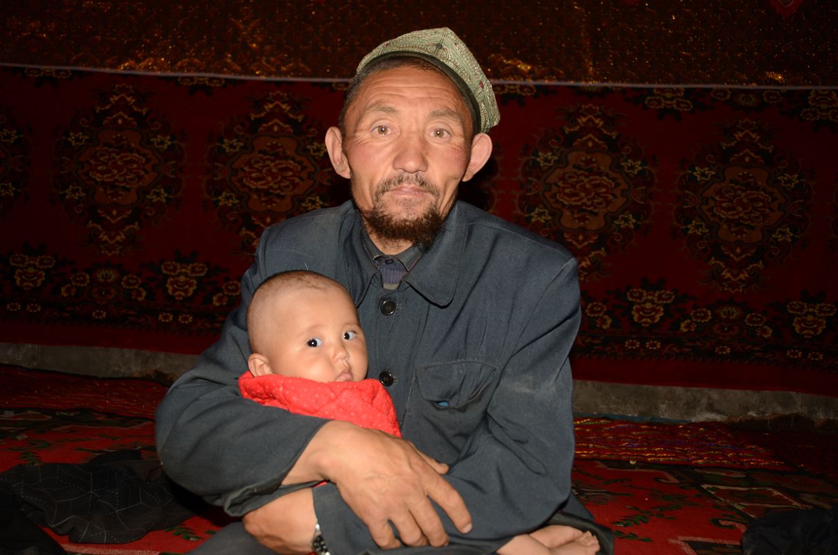 06 Yilik Headman With His Grandchild On The Way To K2 China Trek
